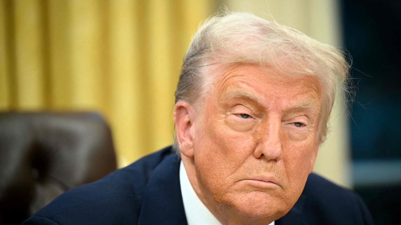 US President Donald Trump speaks to the press after signing an executive order in the Oval Office of the White House in Washington, DC on January 31, 2025. (Photo by Mandel Ngan / AFP)