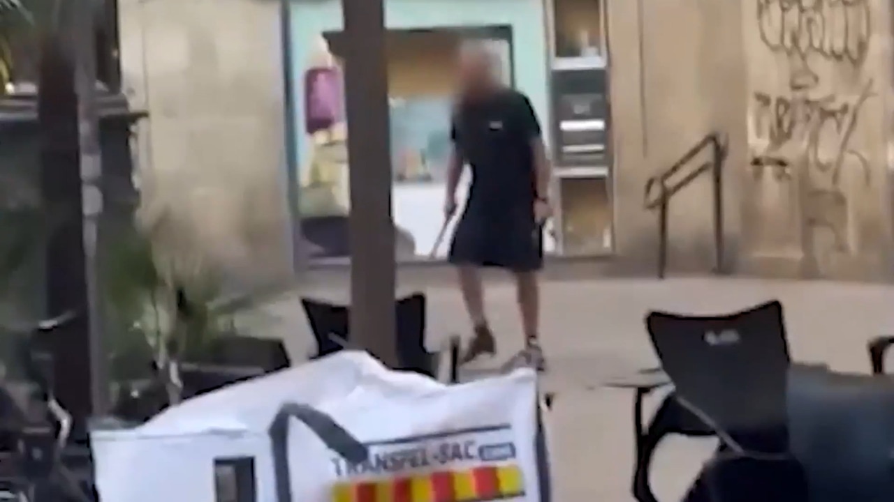 Chilling moment man with knife runs through tourist hotspot