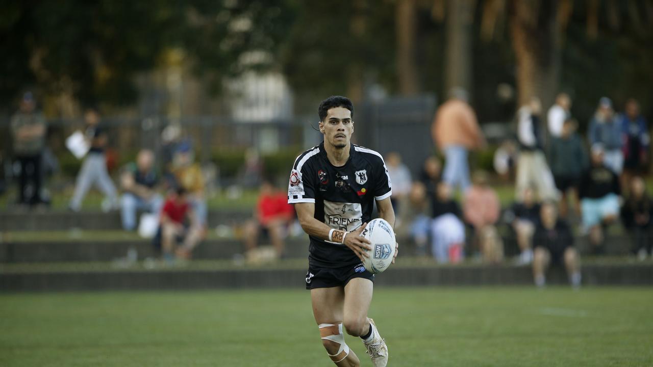 Redfern's Oshay Tyerman with the ball. Picture: John Appleyard