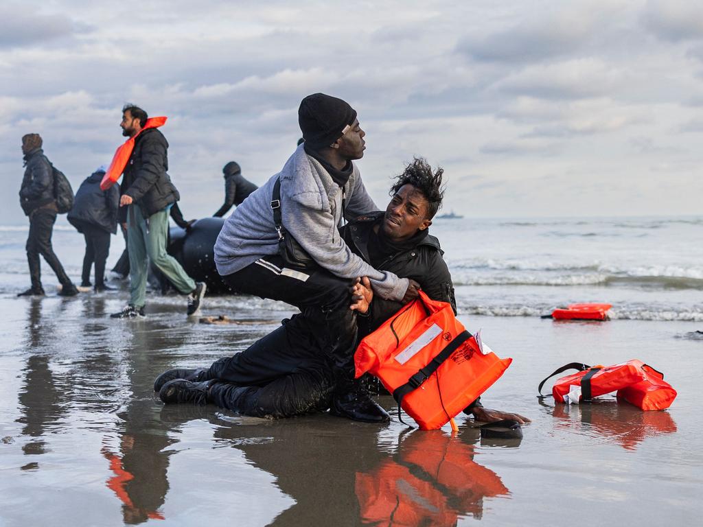 A Sudanese migrant reacts on the shore after leaving a smuggler’s boat, which was punctured by French police officers to prevent migrants from embarking in an attempt to cross the English Channel, on the beach of Gravelines, near Dunkirk, northern France on April 26, 2024. Picture: AFP