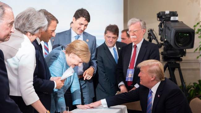 Mr Trump's alternative photo from the G7 summit in Canada.