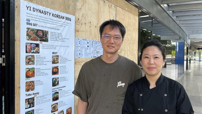 Southport's Yi Dynasty Korean BBQ owners Terry Bae and Sidney Kim have had to board up their windows after wild winds blew in the glass panel. Picture: Emily Walker