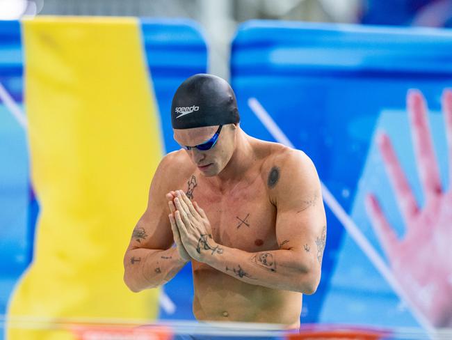 Cody Simpson takes the blocks ahead of the 100m butterfly final.