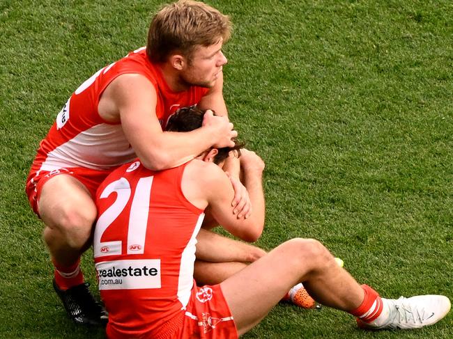 MELBOURNE, AUSTRALIA - SEPTEMBER 28:  A dejected Errol Gulden of the Swans is consoled by Braeden Campbell of the Swans during the 2024 AFL Grand Final match between the Sydney Swans and the Brisbane Lions at The Melbourne Cricket Ground on September 28, 2024 in Melbourne, Australia. (Photo by Adam Trafford/AFL Photos via Getty Images)