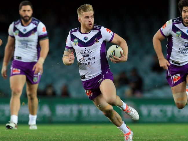 Cameron Munster of the Storm makes a break during the Sydney Roosters v Melbourne Storm NRL round 14 game at Allianz Stadium, Sydney. pic Mark Evans