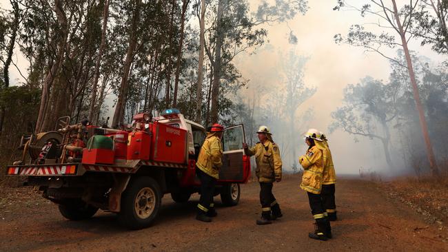 Rural firefighters on the ground in Busbys Flat. Picture: AAP Image/Jason O'Brien