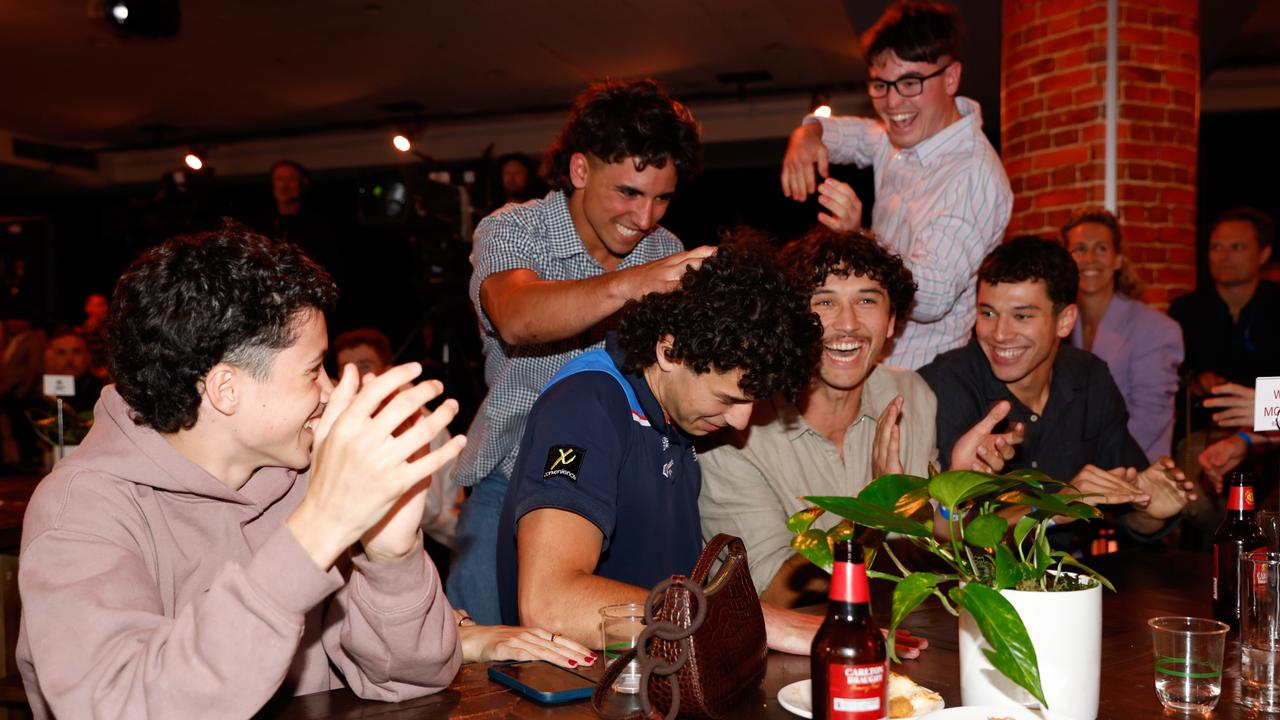 McCabe celebrates with friends and family (Photo by Dylan Burns/AFL Photos via Getty Images)