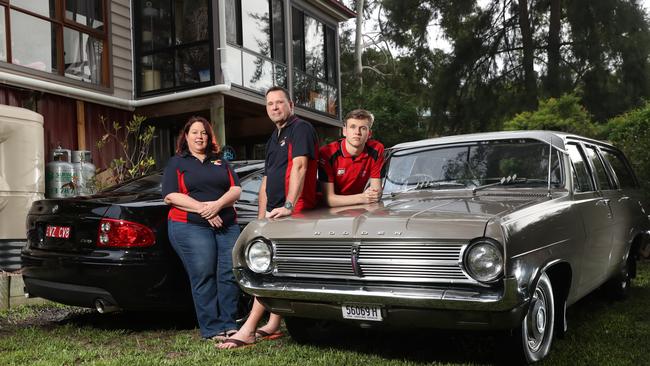 Pictured at home with their two Holdens in Emu Heights are Holden car enthusiasts Fiona, Keith and Connor Caterson. GM has announced that Holden will cease to exist from 2021. Picture: Richard Dobson