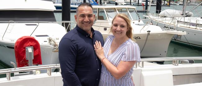 Coal miner Theo Van De Pitte and management consultant Beth Elliott celebrate their Great Barrier Reef engagement back on dry land in the Whitsundays. Picture: Supplied