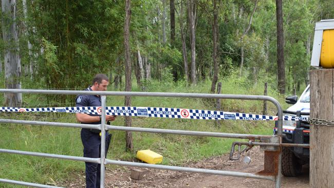 Imbil police senior constable Bill Greer guards the entrance to an Amamoor property, where someone was allegedly murdered on Thursday.