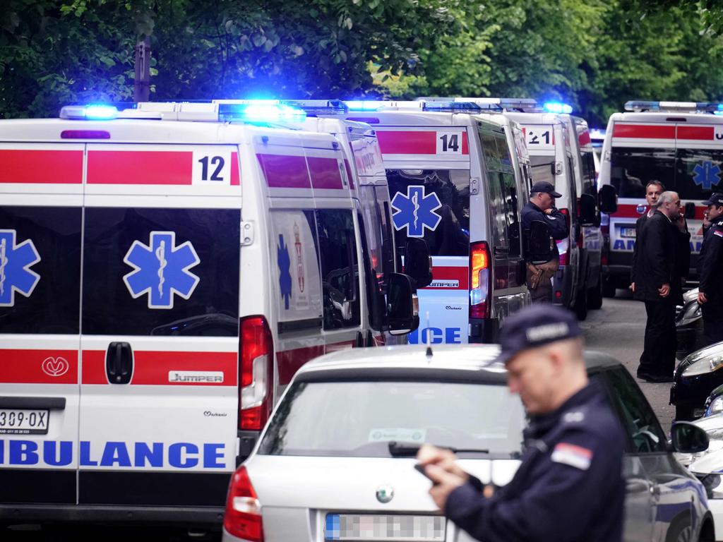 Ambulances at the scene of the shooting. (Photo by Oliver Bunic / AFP)