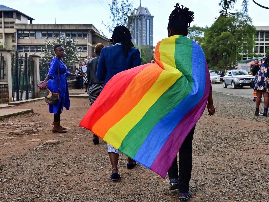 An LGBTQ community member wearing a rainbow flag leaves the Milimani high court in Nairobi, Kenya. The country could be the next one to bring in extreme anti-gay laws. Picture: TONY KARUMBA / AFP