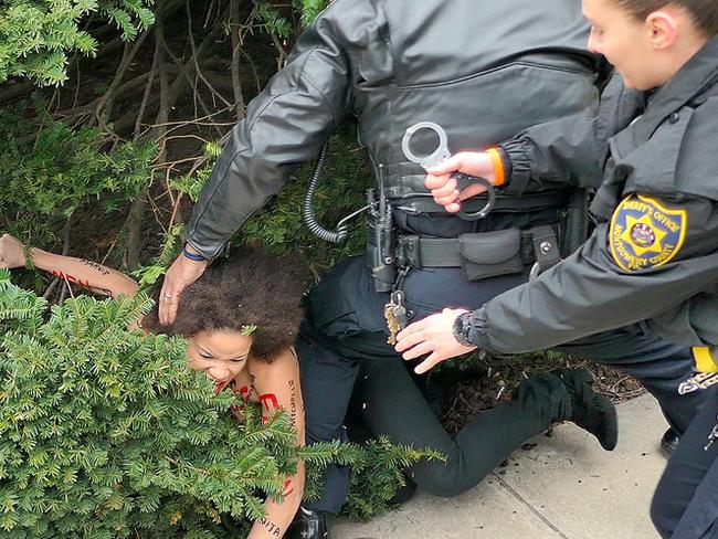 Nicolle Rochelle, 39, is tackled to the ground ahead of the sexual assault retrial, the first major trial of its kind in the age of #MeToo. Picture: MEGA TheMegaAgency.com