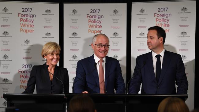 Paper cuts: Foreign Affairs minister Julie Bishop asks the PM and trade minister Steve Ciobo what’s black and white and red all over? Picture: AAP