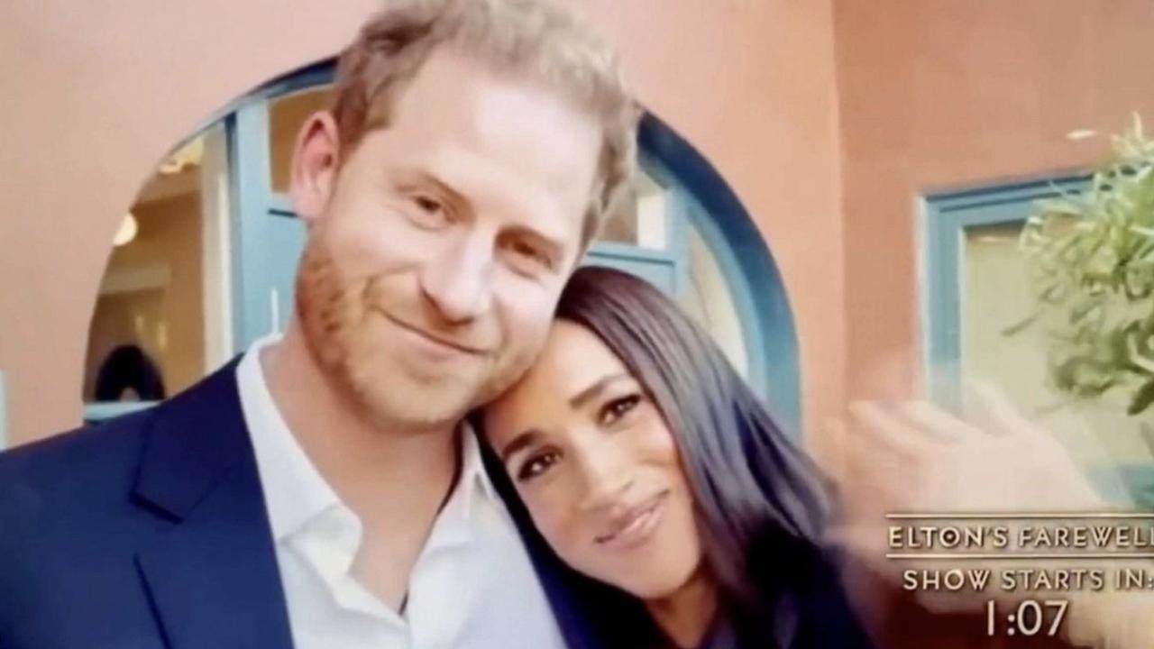 Meghan snuggled up to her husband.