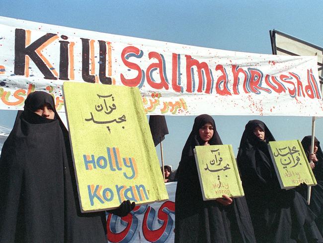 Iranian women are seen holding banners which read "Holly Koran" and "Kill Salman Rushdie" during a demonstration against British writer Salman Rushdie in Tehran in 1989. Picture: AFP