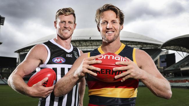 Port Adelaide’s Tom Jonas and Adelaide Crow Rory Sloane at Adelaide Oval. Picture: Sarah Reed