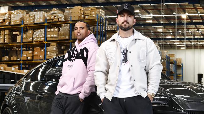 Geedup development manager ‘TK’ with Geedup clothing founder Jake Paco at their Sydney warehouse. Picture: Richard Dobson