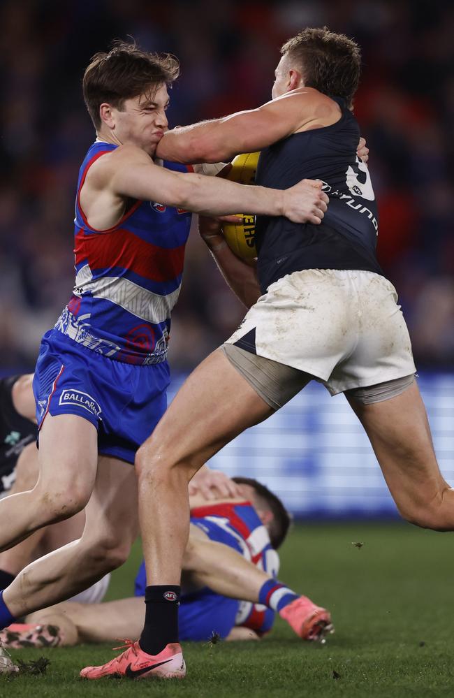 Harvey Gallagher takes a Patrick Cripps elbow to the face. Picture: Darrian Traynor/AFL Photos/via Getty Images