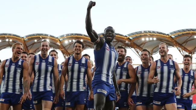 Majak Daw celebrates his first game back as he leads the Kangaroos from the ground. Picture: Michael Klein