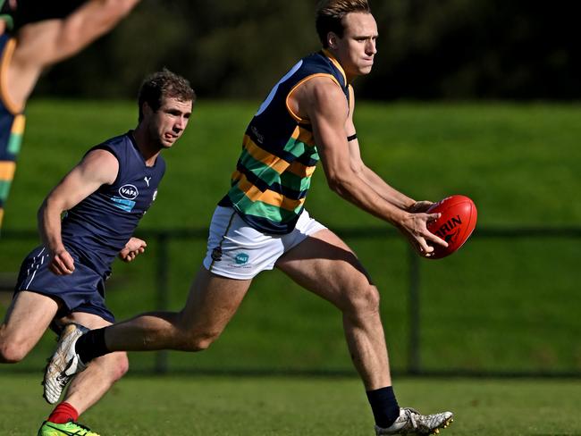 VAFA: Alastair Richards on the run for St Kevin’s. Picture: Andy Brownbill