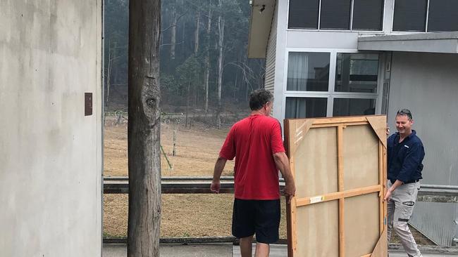 Bundanon Trust staff remove the paintings of Arthur Boyd to protect them from the Currowan fire. Picture: Facebook