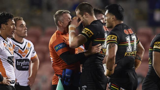 Isaah Yeo of the Panthers is assisted from the field after a head knock.