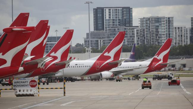 Qantas planes are grounded at Sydney International airport as the coronavirus pandemic brings a halt to overseas travel. Picture: Christian Gilles