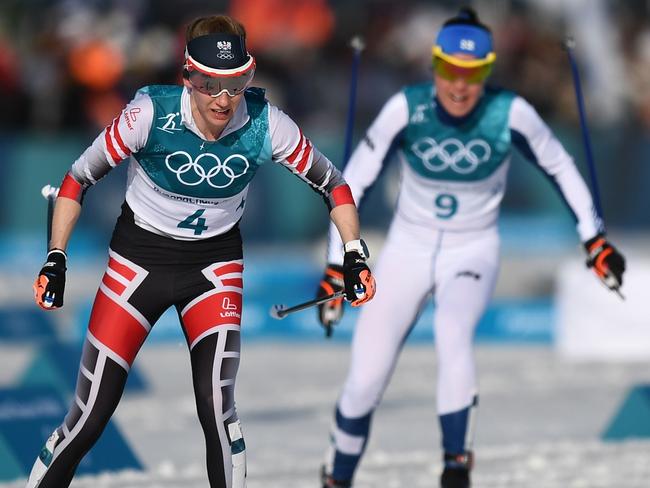 (L-R) Austria's Teresa Stadlober, Finland's Kerttu Niskanen and Finland's Krista Parmakoski compete during the women's 30km cross country mass start classic at the Alpensia cross country ski centre during the Pyeongchang 2018 Winter Olympic Games on February 25, 2018 in Pyeongchang.  / AFP PHOTO / FRANCK FIFE