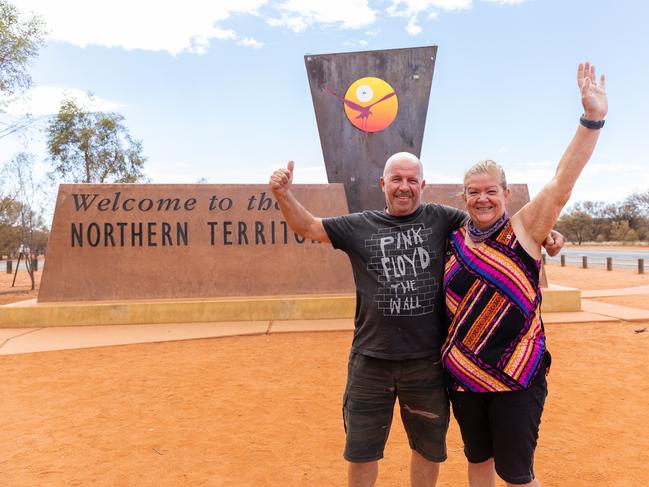 Darwin couple Annette and Barry Bansgrove were thrilled to cross the NT/SA border at 1pm on Tuesday, just hours before new entry restrictions came into force at 4pm. Picture: Emma Murray