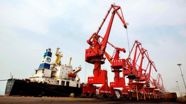 Coal being unloaded from a carrier at a Chinese port. Pic: AFP