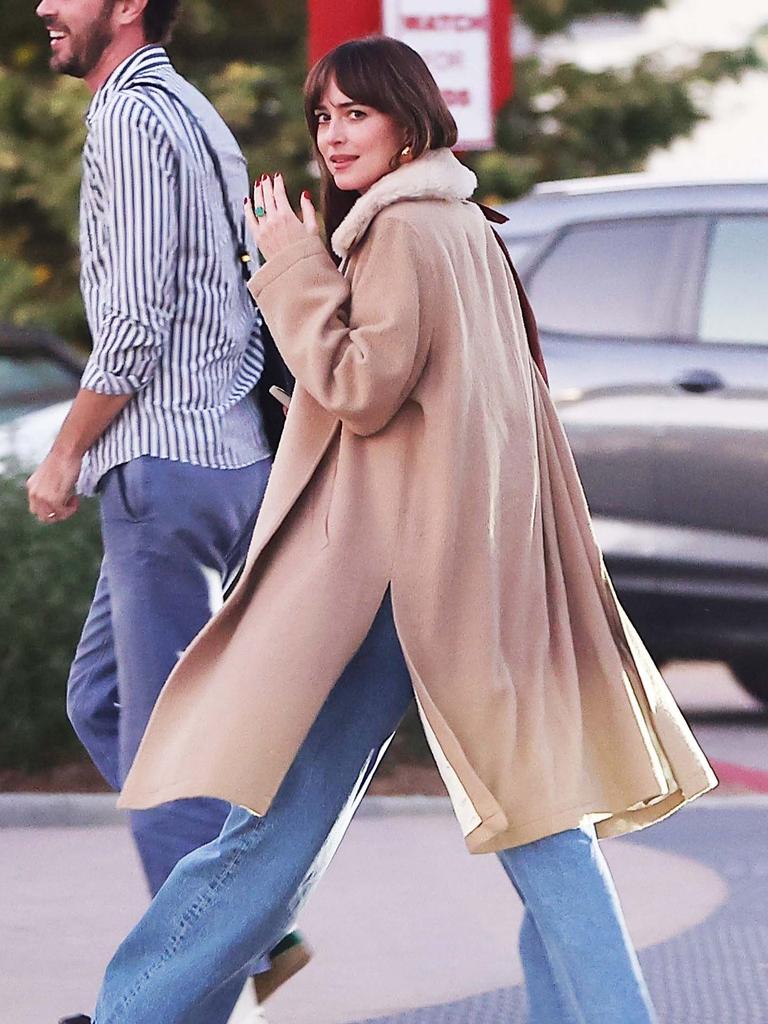 Dakota shows off her engagement ring. Picture: BACKGRID