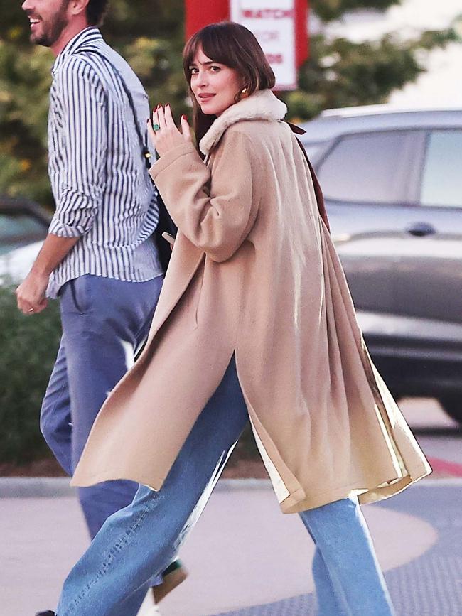 Dakota shows off her engagement ring. Picture: BACKGRID