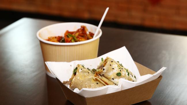 Jaeyouk spicy noodle cup and Xinjiang lamb bing pancake at Lantern Lane. PICTURE: BRENDAN RADKE