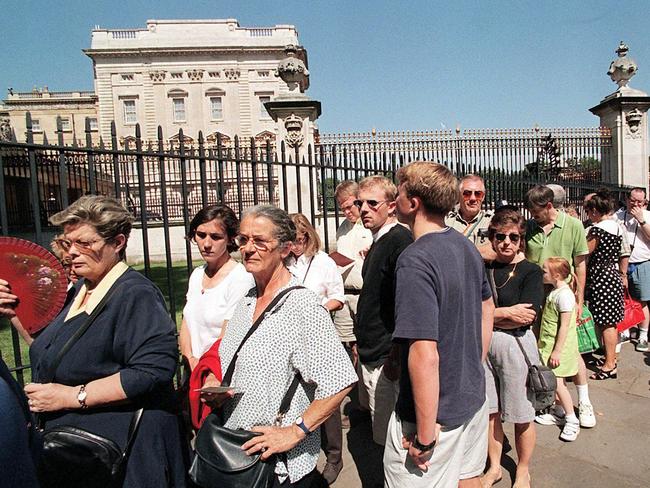 Long lines form outside Buckingham Palace as the annual summer opening of the Palace begins. Picture: AFP