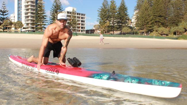 Rainbow Bay's Damien Rider will be out to raise awareness about child abuse and neglect when he attempts to break two world records paddling a board from the Sunshine Coast to Coolangatta in September.