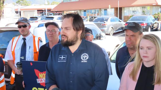 Rail, Bus and Tram Union state secretary Byron Cubit with Labor MP Meg Brown at Metro's Springfield Depot on Wednesday, March 19, 2025.