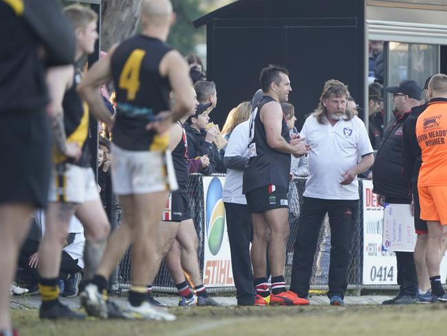 Luke Hodge is treated by a trainer after his finger injury. Picture: Valeriu Campan