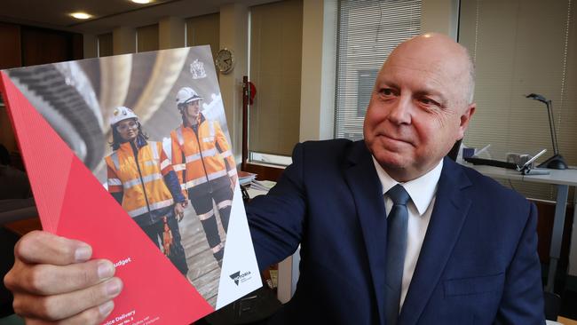 Victorian Treasurer Tim Pallas with the 2023-2024 State Budget report. Picture: David Caird