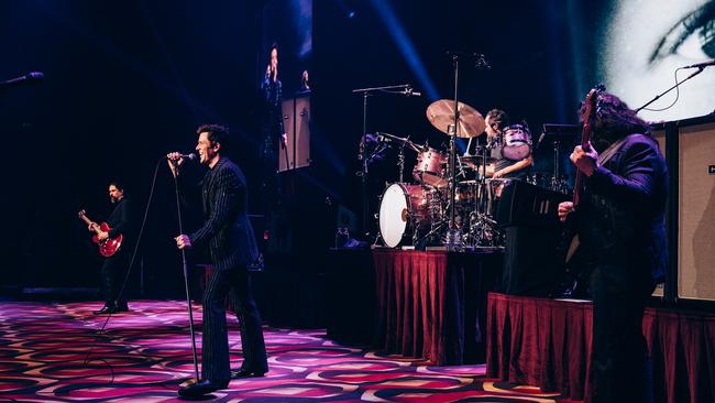 The band braved the Brisbane humidity in suits. Photo: Supplied / Chris Phelps.