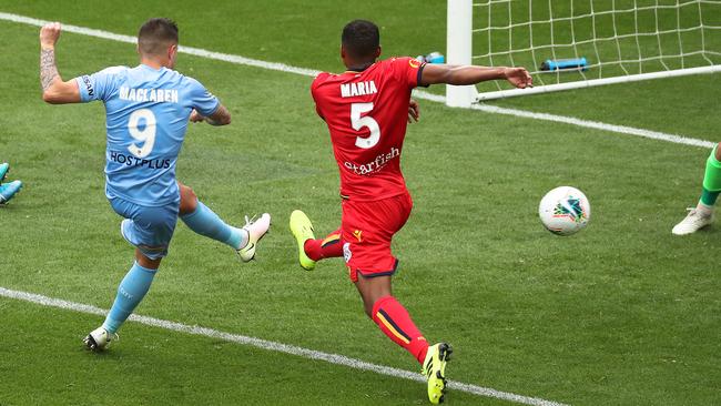 Melbourne City striker Jamie Maclaren fires in his second goal of the game against Adelaide United at AAMI Park. Picture: AAP