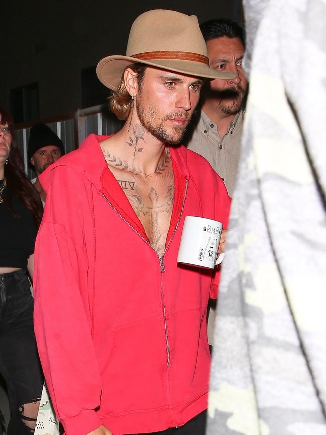 Bieber was on the move with his own mug. Picture: The Hollywood JR / BACKGRID