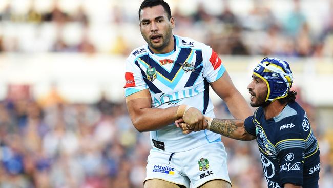 North Queensland Cowboys v Gold Coast Titans from 1300 Smiles Stadium, Townsville. Titans Ryan James helps Cowboys Johnathan Thurston up. Picture: Zak Simmonds