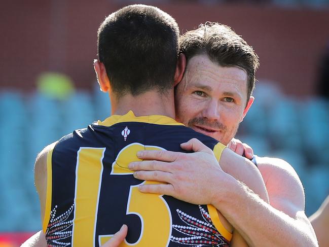 ADELAIDE, AUSTRALIA - AUGUST 23: Patrick Dangerfield of the Cats with Taylor Walker of the Crows after Taylors 200th match during the 2020 AFL Round 13 match between the Adelaide Crows and the Geelong Cats at Adelaide Oval on August 23, 2020 in Adelaide, Australia. (Photo by Matt Turner/AFL Photos via Getty Images)