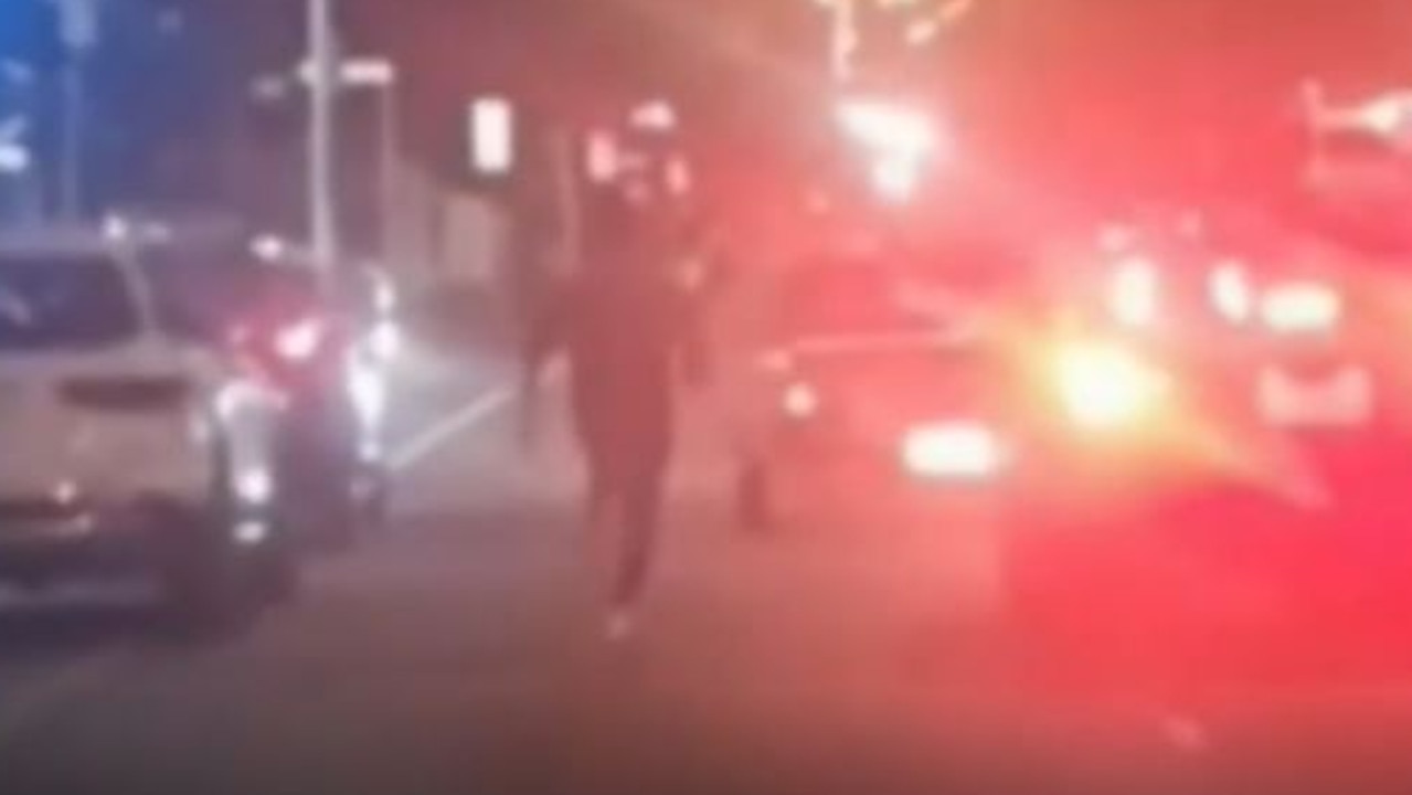 The man was seen chasing the black ute on Friday night. Picture: 9News