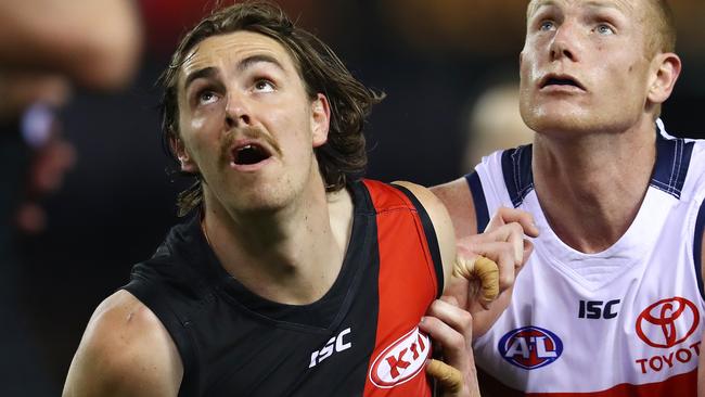 AFL Round 21. Essendon v Adelaide at Etihad Stadium. Essendon's Joe Daniher and Adelaide's Sam Jacobs at  boundary throw in   . Pic: Michael Klein