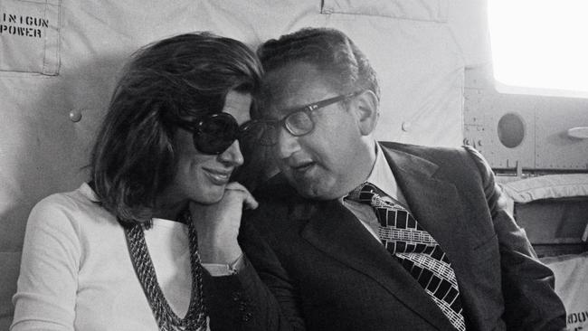 Kissinger shares a moment with his wife, Nancy, on a helicopter in the Middle East in the mid-1970s. Picture: Getty Images