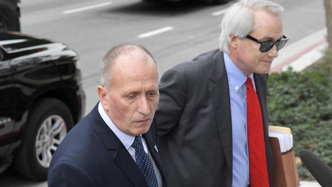 Lin Wood, right, lawyer for British cave expert Vernon Unsworth, left, arrives for the trial. Picture: Mark J Terrill/AP