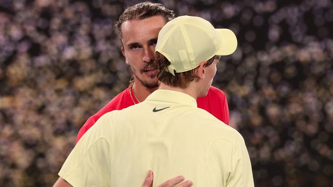 Italy's Jannik Sinner (R) speaks with Germany's Alexander Zverev after his victory during their men's singles final match on day fifteen of the Australian Open tennis tournament in Melbourne on January 26, 2025. (Photo by DAVID GRAY / AFP) / -- IMAGE RESTRICTED TO EDITORIAL USE - STRICTLY NO COMMERCIAL USE --