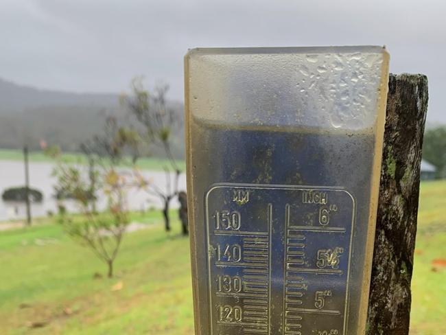 An overflowing rain gauge on a farm at Genoa in far East Gippsland. Picture: Supplied